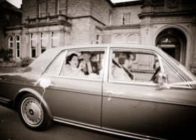 Bride & Groom leave in Chauffeur.